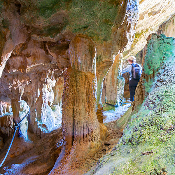 Hiking through the caves leading to Talava Arches on the island of Niue