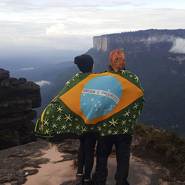 Young couple doing the hike on the trail to Mount Roraima