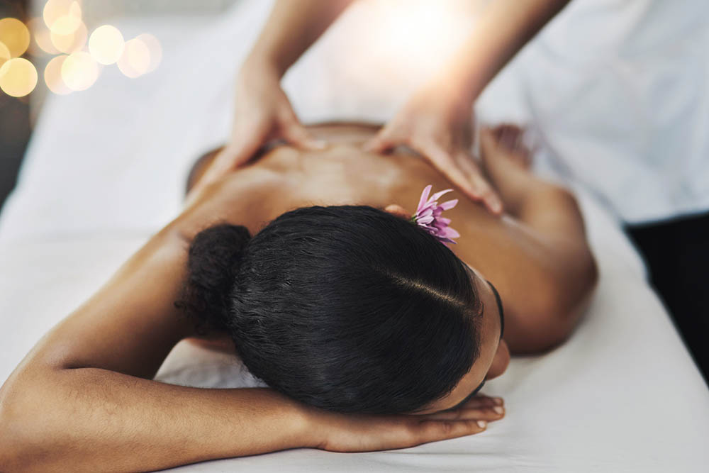 young woman getting a massage at a spa