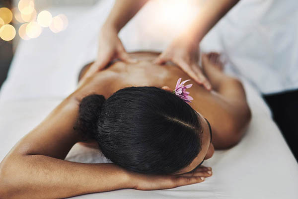 young woman getting a massage at a spa