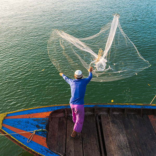 Muslim Fisherman fishing off the coast of Ranong Southern Thailand