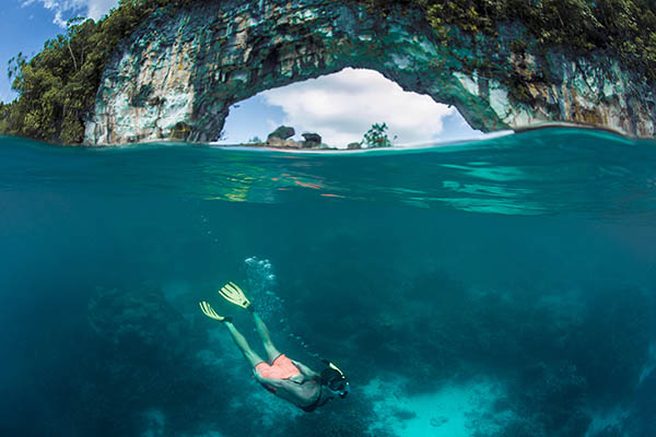 Split image of a free diver woman in the famous Rock Islands, Palau, Micronesia