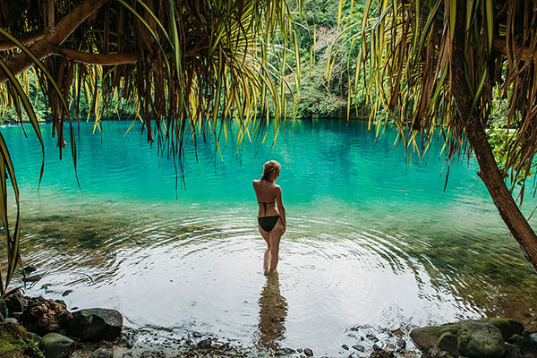 Young woman in a blue lagoon