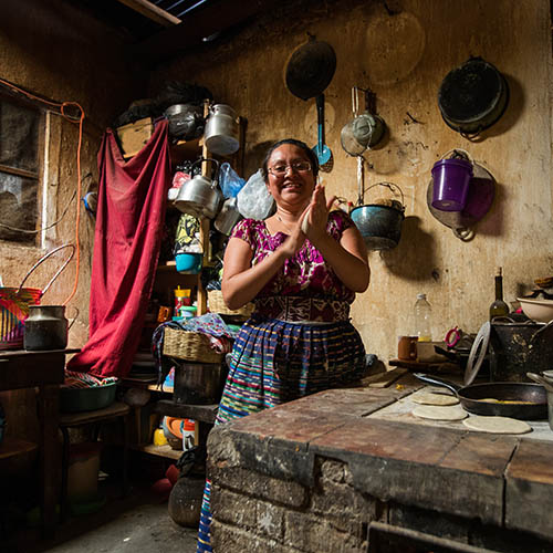 Guatemalan woman making tortillasin San Juan La Laguna, Lake Atitlan, Guatemala