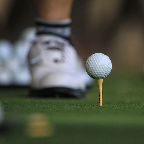 close-up of someone's feet while playing golf