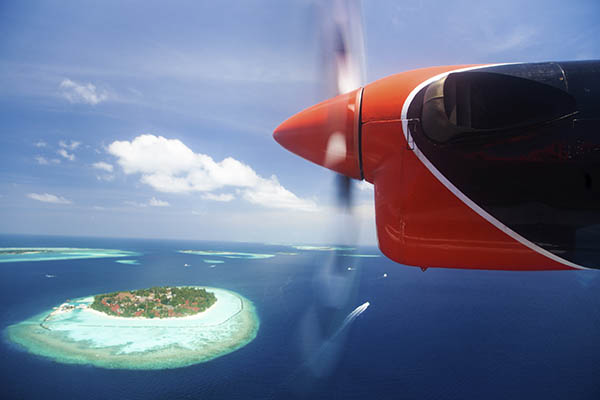 Seaplane flight over an island in the Maldives