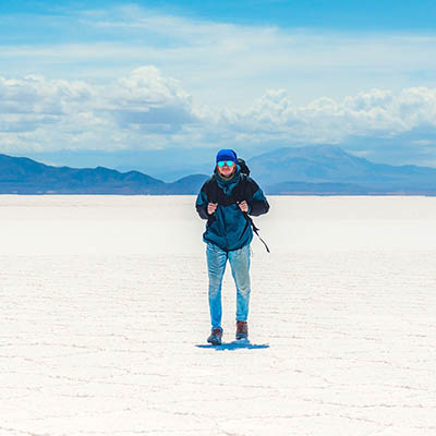 Tourist walking on the Uyuni Salt Flats, Bolivia