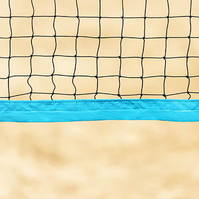 Beach volleyball and beach tennis net on the background of sand