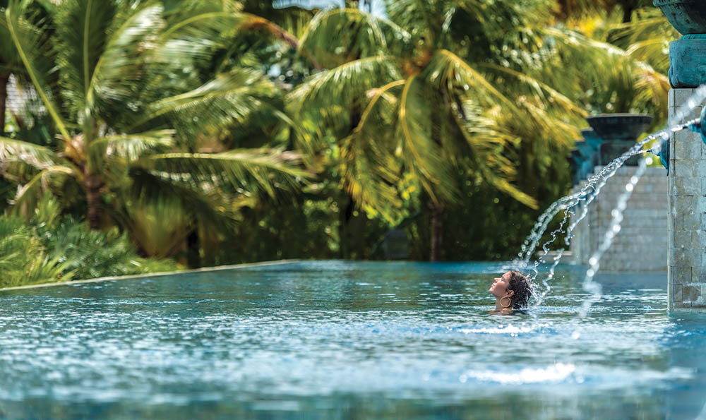 woman in swimming pool at Four Seasons Langkawi, Malaysia