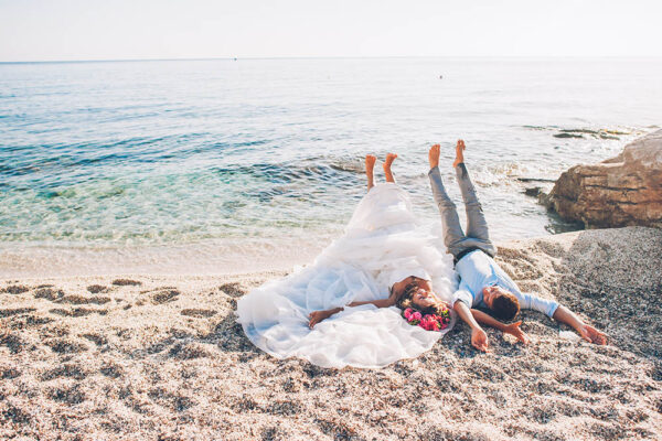 Bride and groom on the beach on their wedding day